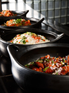 Close up of serving bowls of curry and rice